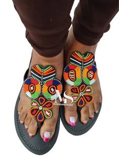 100% handmade using leather and fine beads. Masai beaded sandals are made using the pure original leather and quality African beads.They are inspired by the Masai community They are perfect for any occasion. True to size. We ship worldwide. Feel free to send me a convo for any clarifications Beaded Flat Sandals For Beach, Beaded Flat-heel Sandals For The Beach, Beaded Flat Heel Sandals For Beach, Beaded T-strap Sandals For Beach, Bohemian Embellished Beach Sandals, Embellished Toe Post Festival Sandals, Embellished Toe Post Sandals For Festival, Bohemian Embellished Flat Sandals, Bohemian Embellished Sandals For The Beach