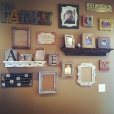 a wall with many different frames on it