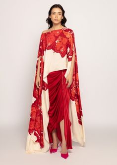 Editor's Note Complete your ensemble with a periwinkle bandhani placement print high-neck kaftan-style cape paired effortlessly with a draped asymmetric skirt adorned with zipper detailing for ... Skirt Cape, Cape Skirt, Maroon Skirt, Cape For Women, Cape Set, Silk Cape, Asymmetric Skirt, Kaftan Style, Draped Skirt