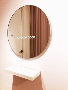 there is a mirror that says you look good on the wall