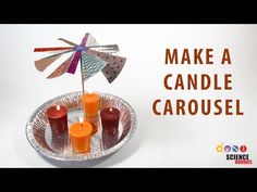 some candles are sitting on a plate with a pinwheel in the middle and an orange candle holder next to it