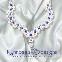 This hand-beaded crystal necklace features a sculpted design to make a beautiful statement on your wedding day or for any special occasion.  It features clear crystals weaved with navy blue crystals in a spectacular design.  This is for the woman who likes to sparkle and shine in all of her fashion styles! Depending on the size, all jewelry comes shipped in either a box with cotton padding or wrapped carefully in tissue paper and mailed in a thick padded envelope to ensure it reaches its destination with no damage.  I am open to all custom orders as well.  Please send me a message and I will work with you to make sure you get exactly what you're looking for! Blue Crystal Necklaces For Wedding, Blue Crystal Necklace For Wedding, Handmade Crystal Necklaces For Wedding, Crystal Beaded Necklaces With Rhinestones For Wedding, Wedding Crystal Beaded Necklace With Faceted Beads, Wedding Jewellery Necklace, Clear Crystals, Cotton Pads, Hand Beading