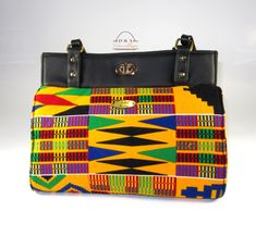 This shoulder handbag exterior features a gorgeous African Kente cotton fabric and black faux leather and has two shoulder handles.   The exterior also features a handy quick access phone pocket inconspicuously located in the seam at the back of the bag and metal bag feet to help keep the bottom of your bag clean.  The interior is lined with the same  polyester blend fabric and and features a zipper  pocket and a split slip pocket with a designated pen pocket.   All of my bags are designed and handmade by me with the utmost love and care. A perfect gift for a mother, daughter, wife, friend, or for yourself. BAG DIMENSIONS:    Width:   12-14"  (30-36cm)    Height:  10" (25.58cm)    Dept:     7" (18cm) BAG EXTERIOR FEATURES:    Gold hardware    Bag handles    Oval Twist Lock    Phone Pocket Elegant Multicolor Shoulder Bag With Double Handle, Multicolor Rectangular Shoulder Bag With Letter Print, Multicolor Fabric Shoulder Bag With Double Handle, Multicolor Double Handle Shoulder Bag With Zipper Pocket, Multicolor Floral Print Bags With Double Handle, Metallic Bag, Pocket Pattern, Pocket Bag, Star Jewelry