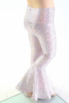 a mannequin is dressed in white and pink sequins with fish scales on it