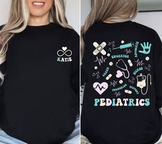 a woman with blonde hair wearing a black shirt that says pediatrics on the back