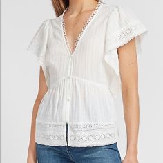 **** **** Express Top With Lace Detail And A Deep V-Neck. It's The Perfect Piece For A Charming Date Night Look Or Shopping Day With Friends. No Longer In Stock At Express.Com This Piece Sold Out Fast. V-Neck Short Ruffle Sleeves Button Front Size Medium Color White Feminine Cotton V-neck Blouse, Feminine V-neck Top For Day Out, Spring V-neck Top For Daywear, Feminine V-neck Cotton Blouse, Chic V-neck Cotton Tops, V-neck Tops For Spring Daywear, V-neck Top For Daywear In Spring, Cotton V-neck Tops For Daywear, White V-neck Tops For Daywear