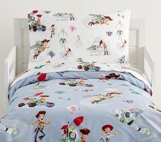 a bed with toy story sheets and pillow cases