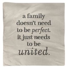 a piece of cloth with the words, a family doesn't need to be perfect it just needs to be united