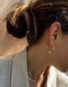 Get the look of a cartilage hoop, no piercing required. These ear cuffs are designed with the perfect amount of thickness and comfort so you can wear them every day - quite literally you never have to take them off. They can be worn in the shower + while you sleep. Simply slide onto the conch part of your ear and go. Wear one for a minimal look or grab a pair for stacking. Trendy Everyday Ear Climbers, Trendy Hypoallergenic Ear Climbers For Everyday, Trendy Everyday Hypoallergenic Ear Climbers, Tarnish Resistant Huggie Ear Cuff, Classic Hoop Ear Cuff Single Earring, Classic Hoop Single Ear Cuff, Adjustable Single Ear Cuff For Everyday Wear, Minimalist Small Hoop Ear Cuff, Tarnish Resistant, Minimalist Small Hoop Ear Cuff Tarnish Resistant