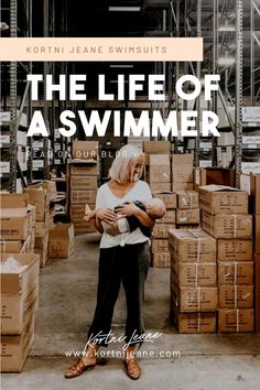 a woman standing in front of boxes with the words, the life of a swimmer