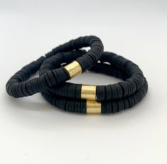 "This listing is for 1 Black Bracelet. Each bracelet is hand-beaded with African clay discs and accented with a brushed gold cylinder bead. The bracelet is made with stretch elastic which makes it comfortable and easy to wear. My bracelets are made to fit an average wrist size of 6.5\"-7\". Take a look around my shop for additional colors to add to your stack! The more the better!" Adjustable Stackable Rondelle Stretch Bracelet, Adjustable Black Heishi Beads Stretch Bracelet, Beads Candy, Black Bracelet, Stackable Bracelets, Black Bracelets, Candy Stripes, Heishi Beads, Photo Bracelet