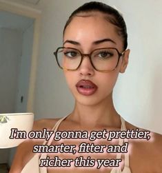 a woman wearing glasses and holding a coffee cup in front of her face with the caption i'm only going to get prettier, smarter after and higher and higher this year