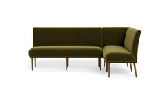 a green couch and ottoman with wooden legs