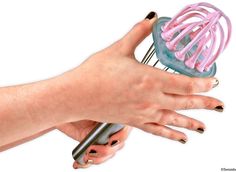 a woman's hand holding a hair dryer