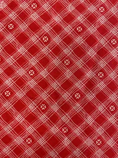 red and white checkered fabric with small dots on the bottom, as well as an image