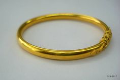 Yellow Gold Bangle Bracelet For Puja, Yellow Gold Bangle For Puja, 22k Gold Round Bangle For Puja, Elegant 22k Gold Bangle For Puja, Yellow Gold Round Bracelet For Puja, Yellow Gold Bracelet For Puja, Yellow Gold Round Bangle For Puja, Ceremonial Temple Jewelry Gold Bracelet, Elegant Gold Bangle Bracelet For Puja