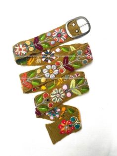 "Hand embroidered belt floral colorful peruvian embroidered belts floral ethnic belt boho belt wool, gifts for her floral ethnic belt peru Size & Fit, available Sizes: All belts Width are or centimeters approximately  Width: 4.5centimeters or 2inches. Size: XS Length to first hole from buckle: 32.3 inches or 82 centimeters approximately Length to last hole from buckle: 23 inches or 59 centimeters approximately Total Length: 35.5 inches or 90 centimeters approximately Size: SMALL Length to first Folk Style Multicolor Fabric Belt, Folk Style Multicolor Embroidered Belt, Multicolor Fabric Belt In Folk Style, Folk Multicolor Embroidered Belt, Multicolor Folk Fabric Belt, Artisan Multicolor Fabric Belt, Adjustable Multicolor Bohemian Belts, Bohemian Fabric Belt For Festivals, Bohemian Embroidered Belt For Spring