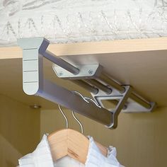 the clothes hangers are attached to the rails