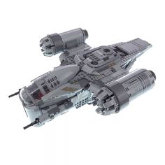 a lego model of a space ship on a white background