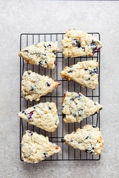 blueberry white chocolate scones on a cooling rack with text overlay that reads, how to make blueberry white chocolate scones