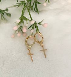 These delicate gold-plated tiny Cross hoop earrings are a mindfulness gift, it's perfect as a Baptism gift or as a girlfriend gift as well.  You will look adorable wearing these dainty earrings. The cute earrings you'll never want to take off. 💗 ITEM DETAILS: The total length of the earrings: 1 inch Charm size: Width 0.7mm -  Height 11mm Materials: 18K Gold plated. Color necklace available: Gold. 💗 GIFT IT Jewelry comes in a cute bag ready to gift! If you wish your item to be a gift, please let me know and I will include a cute little card with a personal message. 💗 CARING FOR YOUR JEWELRY: I recommend that you do not wear your jewelry in the shower, in ocean water, or during sporting activities, and avoid exposure to oils, perfumes, and chemicals that may affect it. Apply all cosmetics Small Hoop Gold Cartilage Earrings As Gift, Tarnish Resistant 14k Gold Filled Cartilage Earrings For Gift, Dainty Gold Huggie Earrings For Gift, Single 14k Gold Filled Huggie Earring For Gift, Hypoallergenic Gold Plated Cartilage Earrings For Gift, Gold Huggie Cartilage Earrings As Gift, Rose Gold Hypoallergenic Dangle Huggie Earrings, Hypoallergenic 14k Gold Filled Cartilage Earrings For Gift, Minimalist Hypoallergenic Hoop Earrings For Her