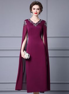 Placidly blending elegance and modern charm, this mother of the bride dress in a stunning plum hue is designed to stand out. The luxurious fabric drapes beautifully, providing both comfort and a subtle sheen that adds a touch of refined glamour. The dress features a V-neckline adorned with intricate beadwork, offering a unique and sophisticated element. The dramatic cape sleeves add a stylish and modern touch, ensuring a comfortable fit. The tailored fit accentuates your natural curves, creating a sleek and polished silhouette. The floor-length hemline ensures a classic and timeless look, suitable for various wedding settings. Pair this dress with elegant accessories and a chic clutch to complete your ensemble. This dress is ideal for any mother of the bride who wants to feel beautiful, co Haute Couture Wedding Dress, Office Dresses For Women, Black Prom, Cape Sleeves, Wedding Dress Couture, Couture Wedding, Solid Red, Mother Of The Bride Dress, Style Office