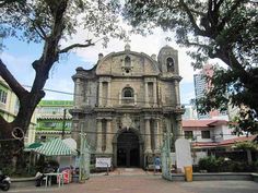 an old church in the middle of a city