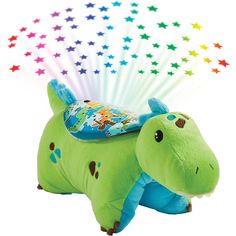 a green stuffed animal with stars on it's back and its head in the shape of a hippopotamus