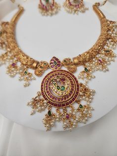 Add charm and charisma to your beautiful personality with these beautifully designed and handcrafted Brass necklaces. The antique finish gives this Necklace a very eye-catching look. Long necklace designed beautifully and compliments very well. Wear it with any of your party or casual outfits and grab compliments all the way! Gold Kundan Necklace With Peacock Design, Gold Kundan Necklace With Peacock Design In Chandbali Shape, Metal Kundan Temple Jewelry Necklace, Gold Chandbali Necklace With Peacock Design, Gold Chandbali Necklaces With Peacock Design, Festive Gold Necklace With Peacock Design, Gold Necklace With Peacock Design, Gold Necklace With Peacock Design In Temple Jewelry Style, Gold Temple Jewelry Necklace With Peacock Design