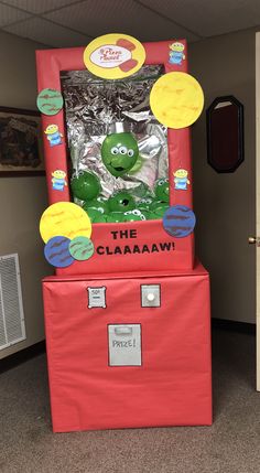 the gummy machine costume is on display in an office cubicle