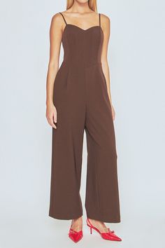 Take your style up a notch with this hot bustier wide leg jumpsuit. With on-trend wide legs and adjustable spaghetti straps, this chic jumpsuit is perfect for any event. And with a backless design, you'll stun everyone in attendance. Dress it up or dress it down this versatile jumpsuit is perfect for any occasion. Add some heels and you're ready to go! Bustier jumpsuit Adjustable spaghetti straps Backless Center zipper Side pockets Wide legs Lined Hand wash cold Do not bleach Do not tumble dry I Elegant Jumpsuits And Rompers With Spaghetti Straps, Elegant Evening Jumpsuit With Spaghetti Straps, Chic Evening Jumpsuit With Spaghetti Straps, Elegant Solid Jumpsuits With Spaghetti Straps, Strapless Jumpsuit For Date Night, Chic Brown Jumpsuits And Rompers For Party, Elegant Brown Jumpsuits And Rompers For Summer, Elegant Brown Summer Jumpsuits And Rompers, Chic Brown Jumpsuits And Rompers For Night Out