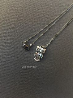 "Sweet little owl necklace. Detailed silver owl charm hangs on a dainty stainless steel chain with a sturdy stainless steel jump ring. This necklace is 18\" long with lobster clasp. *Stainless steel chain and findings *Alloy owl charm *Handmade with love <3 *Matching earrings https://www.etsy.com/listing/649356977/little-silver-owl-earrings-little-owl?ref=shop_home_active_1 Like Jmesjewelrybox on Facebook for updates on new jewelry, upcoming sales and giveaways! Plus Facebook fans save 5% :D Owl Necklace Silver, Owl Earrings, Silver Owl, Owl Necklace, Owl Jewelry, Owl Pendant, New Jewelry, Grab Bags, Organza Bags