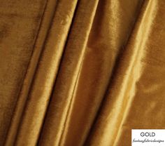 a close up image of a gold colored velvet fabric with very thin lines on it