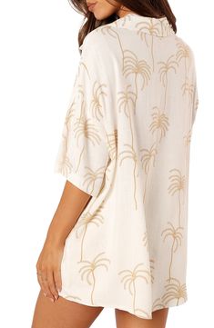 Vacation is calling in this breezy linen-kissed shirt designed with neutral palms and dropped shoulders. Front button closure Notched collar Elbow-length sleeves 70% rayon, 30% linen Hand wash, dry flat Imported Vacation Rayon Blouse With Relaxed Fit, Relaxed Fit Rayon Blouse For Vacation, White Linen Beachwear Tops, White Rayon Beach Blouse, White Rayon Tops For Vacation, White Rayon Blouse For Vacation, Beach Rayon Blouse Relaxed Fit, White Rayon Summer Blouse, Relaxed Fit Rayon Beach Blouse