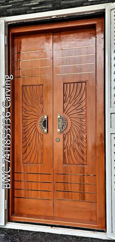 two wooden doors with decorative designs on them