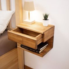 a small wooden table with a lamp on top