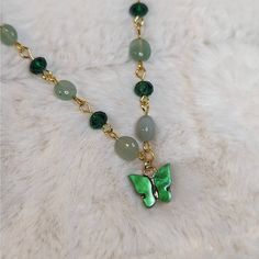 Green Aventurine And Glass Crystal Beaded Gold Choker Necklace With Green Butterfly Charm Measures Approximately 14" And Is Finished With A Gold Toned Stainless Steel Chain With A Lobster Clasp And 1.5" Extension Chain. Green Jade Beaded Chain Jewelry, Green Jade Jewelry With Beaded Chain, Jade Beaded Pendant Necklaces As Gift, Jade Beaded Pendant Necklaces For Gifts, Jade Pendant Beaded Necklaces As Gift, Jade Pendant Beaded Necklaces For Gifts, Jade Pendant Beaded Necklace For Gifts, Jade Pendant Crystal Necklace For Jewelry Making, Green Beaded Chain Crystal Necklace Gift