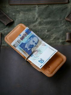 Discover the perfect blend of style and utility with our Personalized Leather Money Clip Wallet. This slim cardholder not only slips seamlessly into your pocket but also keeps your essentials organized. Ideal for any occasion, it makes a thoughtful gift adding a personal touch that speaks volumes with their initials, creating a timeless piece they'll treasure. Shop now and elevate your gifting game! DETAILS: -Durable Construction -Coin Pocket with Secure Closure -Money Clip built-in keeps the ba Daily Use Rectangular Trifold Wallet With Flat Pocket, Rectangular Trifold Wallet With Flat Pocket For Daily Use, Rectangular Trifold Wallet For Daily Use, Daily Rectangular Trifold Wallet With Flat Pocket, Bifold Wallet With Key Clip As Gift, Rectangular Card Holder With Belt Clip For Everyday Use, Everyday Bifold Card Holder With Key Clip, Everyday Rectangular Card Holder With Belt Clip, Everyday Use Trifold Wallet With Belt Clip