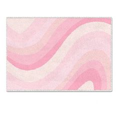 a pink and white rug with waves on it