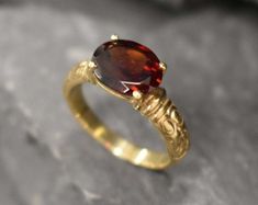 Gold Garnet Ring set with a large Natural Garnet, in a flawless diamond cut, clarity & deep natural color, from Mozambique, at 10x8mm, 3 Carats. Made of Solid 925 Sterling Silver ☞ made to last. **The ring is plated with 18K Gold (the thickest plating - 3 Micron) over Solid 925 Sterling Silver. ☞ Choose your size ☞ I resize (before shipping) for FREE to Any size* Matching Earrings & Matching Pendant - please ask me January Birthstone - Genuine & Natural Stones ❀ ⌛Last Ring left ⌛   ❀ Each Natura Garnet 3 Stone 18k Gold Ring, Red Diamond Ring, Gold Garnet Ring, Garnet Ring Vintage, Gold Vintage Ring, January Birthstone Rings, Vintage Gold Rings, Flawless Diamond, Garnet And Gold