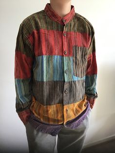 Man Holiday Patchwork Shirt Hippie Festival Collarless Granddad Colorful Top --------------------------------------------------------------------------------------                                                             CODE NUMBER 51 Description: 100% Cotton shirts Patchwork shirts  Bottom up Stonewashed faded vintage looks Long sleeves, collarless and loose fit design. Handmade in Nepal. PLEASE  CHECK OUR MEASUREMENT CHART BEFORE YOU BUY IT! Measurements: Medium: Chest=40" Length=27" Large Brown Cotton Patchwork Tops, Long Sleeve Cotton Shirt With Patchwork, Cotton Long Sleeve Shirt With Patchwork, Striped Cotton Tops With Patchwork, Red Long Sleeve Patchwork Shirt, Green Cotton Patchwork Top, Colorful Patchwork Top For Fall, Long Sleeve Multicolor Cotton Shirt, Multicolor Long Sleeve Cotton Shirt