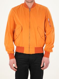 Long-sleeved orange jacket. It features front zip closure, two side buttoned flap pockets, one zipped pocket on left sleeve and contrasting details on neck, cuffs and hem. The model is 184cm tall and wears size 48. Size nationality: IT Product number: 35774814 Product code: 22CTCUC04064A06105434 Composition: 60% polyester, 40% polyamide Sporty Orange Long Sleeve Outerwear, Functional Orange Long Sleeve Outerwear, Orange Long Sleeve Outerwear With Pockets, Orange Long Sleeve Sports Outerwear, Functional Orange Hooded Outerwear, Orange Long-sleeve Outerwear With Pockets, Orange Jacket, Zipper Jacket, Field Jacket