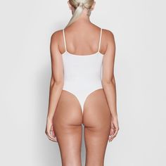 Fits Everybody Cami Bodysuit | Marble — With its wide scoop neckline and low back providing the perfect foundation under clothing, this Cami Bodysuit is an essential wardrobe foundation. Features a high cut leg opening and thong back that remains invisible under clothing. Backless Bodysuit With Built-in Bra And Minimal Stretch, Second-skin Bodysuit With Built-in Bra And Low Back, Elegant Seamless Backless Bodysuit, Shapewear Bodysuit With High-cut Leg And Lined Body, Seamless Backless Shapewear Bodysuit, Shapewear Bodysuit With High-cut Leg, Elegant High Cut Smoothing Bodysuit, Second-skin High-cut Leg Shapewear Bodysuit, Seamless Stretch Low-cut Bodysuit