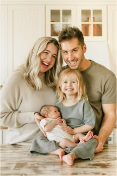 a man, woman and child are smiling for the camera