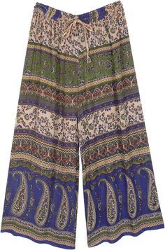 An ethnic bohemian pants with a wide leg flare - a must-buy palazzo pants because of its unique traditional style - great pajama street wear for travel.  There are different motifs, including folk paisley, printed in various sections of the pants. #tlb #vacationclothing #beachwrap #Floral #Paisley #bohemianfashion #Indian #PalazzoPants #StreetWearPajama Bohemian Wide Leg Pants For Vacation, Casual Wide Leg Pants With Boho Print, Bohemian Long Pants With Paisley Print, Bohemian Paisley Print Summer Pants, Bohemian Bottoms With Paisley Print, Bohemian Paisley Print Bottoms For Festival, Bohemian Paisley Print Pants For Vacation, Bohemian Summer Pants With Paisley Print, Bohemian Paisley Print Vacation Pants