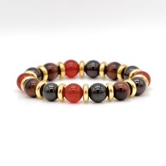 Unleash your inner strength and attract success with our natural stone bracelet - a stunning and stylish accessory designed to improve your emotional well-being and help you overcome life's difficulties. This exceptional bracelet made of Tiger Eye Red, Garnet Almandine, Carnelian stones ideal for those who seek to attract success, find balance and achieve their goals. Crafted from the finest natural stones, our bracelet features powerful properties that help to protect against negative energy, attract good luck, and promote balance in your life. Our bracelet also helps to strengthen memory and develop insight, making it the perfect talisman for students and professionals alike. Whether you're dealing with a difficult situation or seeking to attract more success in your life, our Natural St Red Agate Gemstone Beaded Bracelets, Red Agate Bracelets With Gemstone Beads, Elegant Red Beaded Bracelets For Meditation, Elegant Red Carnelian Bracelet, Red Agate Bracelets For Meditation, Carnelian Bracelets With Natural Stone Round Beads, Carnelian Bracelets With Natural Round Stones, Carnelian Bracelets With Natural Round Beads, Red Carnelian Bracelets With Polished Beads