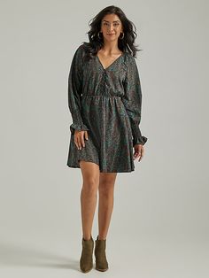 PERFECT WESTERN CHARM Few styles are quite as flattering as this fit and flare silhouette. The Wrangler long-sleeve button front dress offers a fitted style through the hips and then releases to a flared, A-line skirt that ends just above the knee. This flattering dress features a v-neck, a deep chevron sketch print, and with its smocked cuff poet sleeves, this dress makes a perfect year-round style staple. Wrangler Women, Denim Midi Dress, Flattering Dress, Button Front Dress, Fitted Style, Antique Buttons, Flattering Dresses, Work Wear Women, Dress Clothes For Women