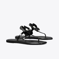 A sculpted bloom embellishes a classic flip-flop sandal with a playful focal point. The jelly outsole is perfect for the beach or to wear poolside. Chanel Jelly Sandals, Flower Jelly, Jelly Flower, Flower Sandals, Beach Slides, Jelly Sandals, Footwear Design Women, Designer Sandals, Black Slip Ons