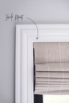 an open window with roman blinds and the words how to measure them on it's side