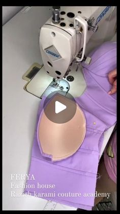 a woman is using a sewing machine to sew on her purple dress with the words ferya fashion house